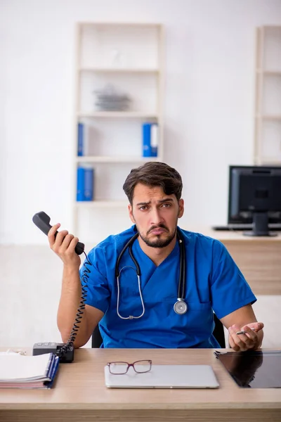 Young male doctor in telemedicine concept — Stock Photo, Image