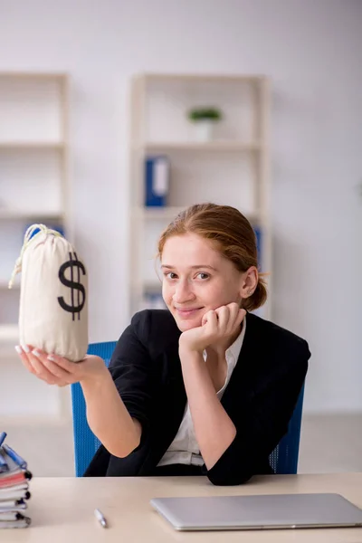 Young female employee in remuneration concept — Stock Photo, Image