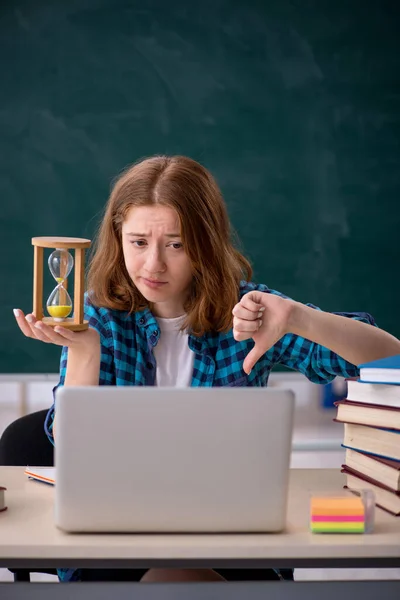 Young female student in time management concept — Stock Photo, Image