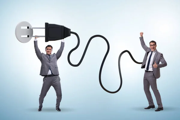 Businessman being powered by electric power — Stock Photo, Image