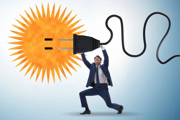 Empresario en concepto de energía solar —  Fotos de Stock