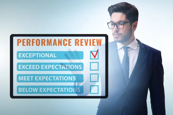 Annual performance review concept with businessman — Stock Photo, Image
