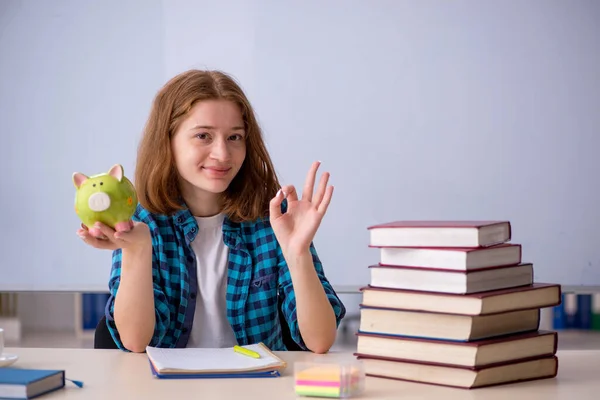 Young female student in expensive education concept — Stock Photo, Image