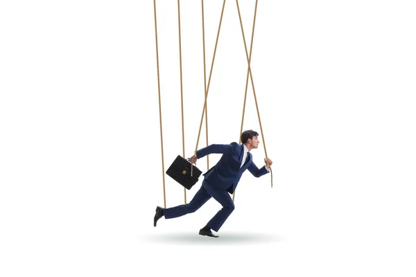 Businessman puppet being manipulated by ropes — Stock Photo, Image