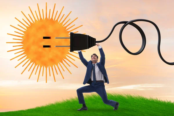 Empresario en concepto de energía solar —  Fotos de Stock