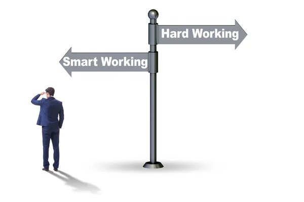 Businessman at the crossroads on working smart or hard — Stock Photo, Image