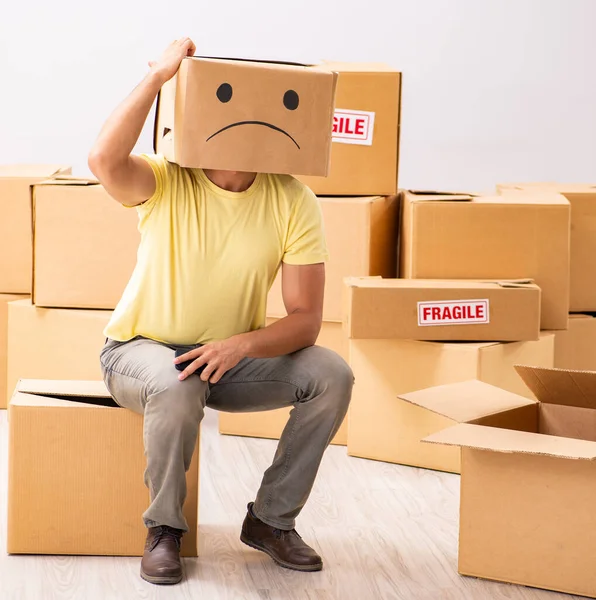 The unhappy man with box instead of his head