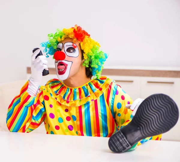 The male clown preparing for perfomance at home — Stock Photo, Image