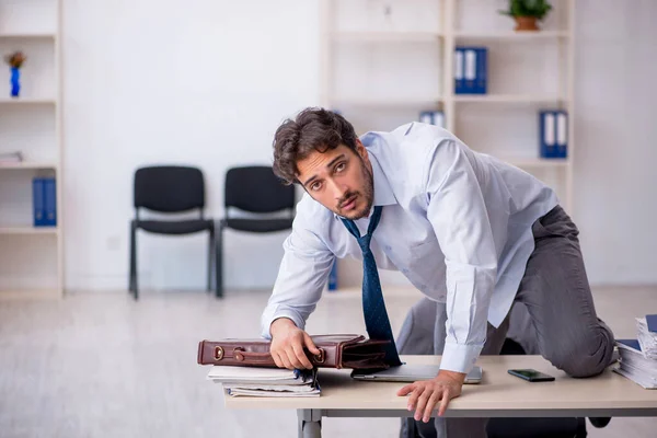 Young male employee in oversleeping concept — Stock Photo, Image