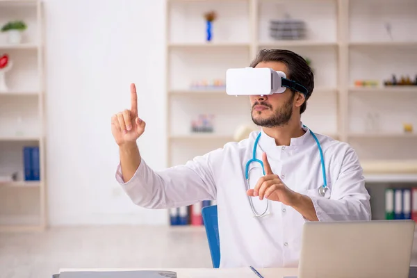 Young male doctor wearing virtual glasses — Stock Photo, Image