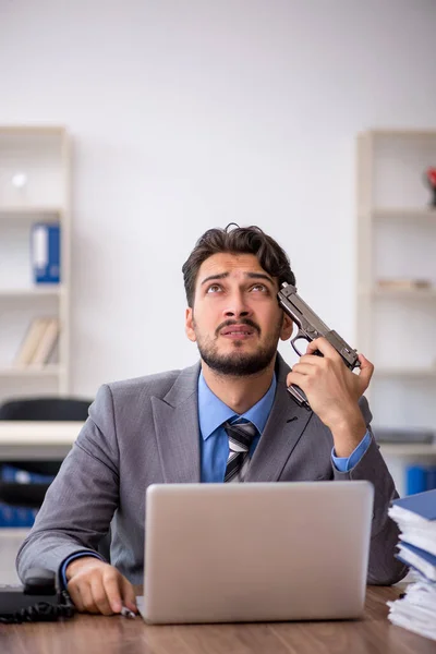 Young male employee committing suicide in the office — Stock Photo, Image