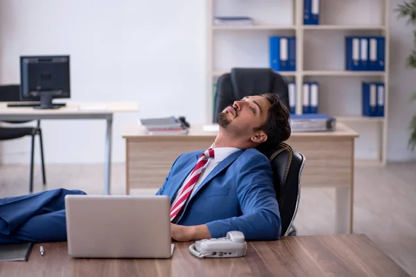 Young male employee working in the office — Stock Photo, Image