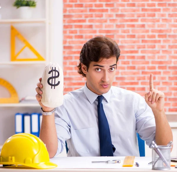 Construction supervisor working on blueprints — Stock Photo, Image