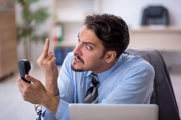 Young male employee working in the office — Stock Photo, Image