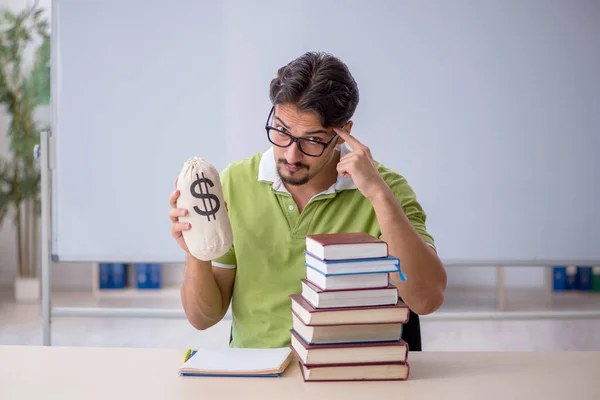 Young male student in expensive education concept — Stock Photo, Image
