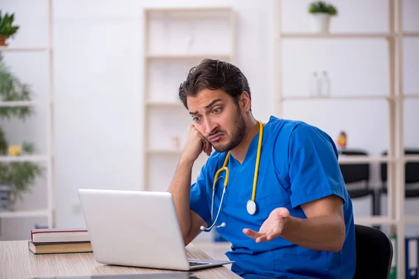 Young male doctor in telemedicine concept — Stock Photo, Image