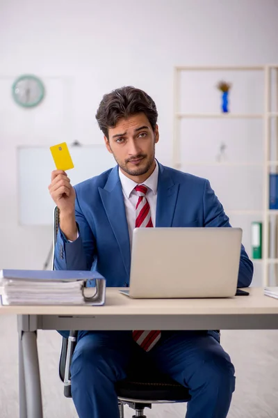 Young male employee in e-commerce concept — Stock Photo, Image