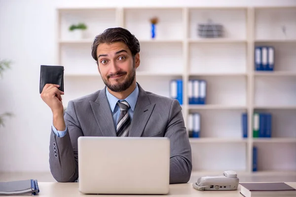 Young male employee holding wallet — Stock Photo, Image