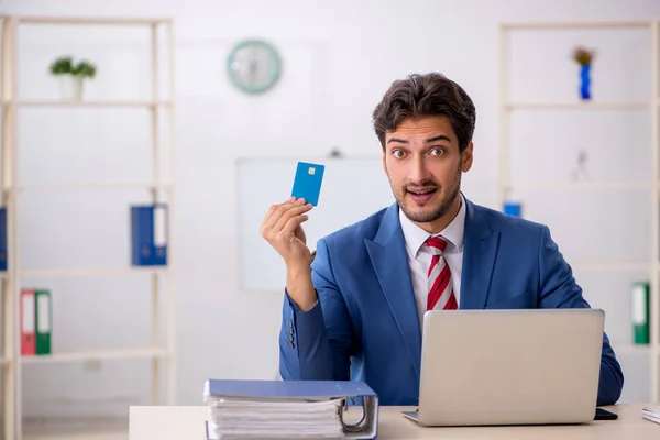 Young male employee in e-commerce concept — Stock Photo, Image