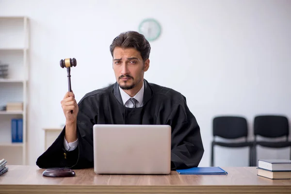 Young male judge working in the courthouse — Stock Photo, Image