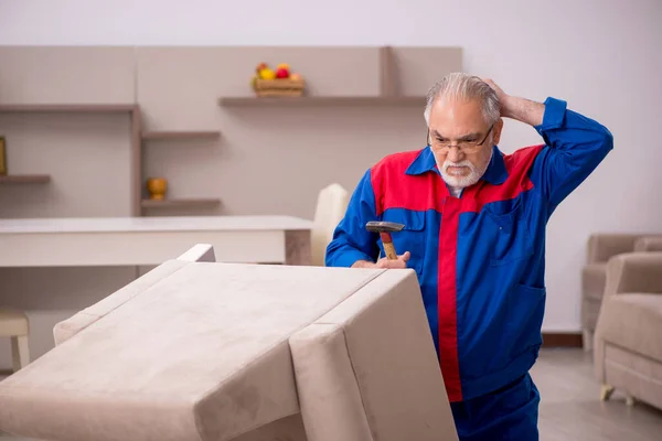 Old male carpenter working indoors — Stock Photo, Image