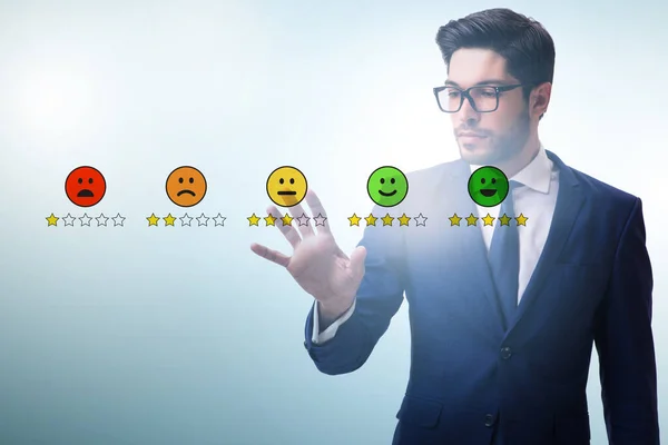 Businessman in customer feedback concept — Stock Photo, Image
