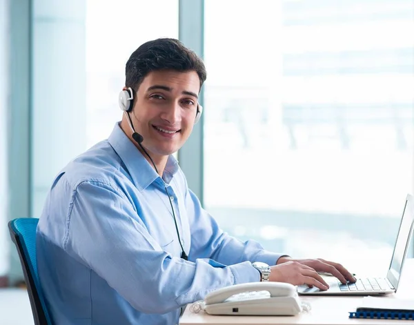 Male call-center operator in business concept — Stock Photo, Image