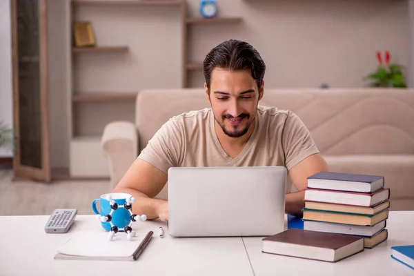 Young student studying at home during pandemic