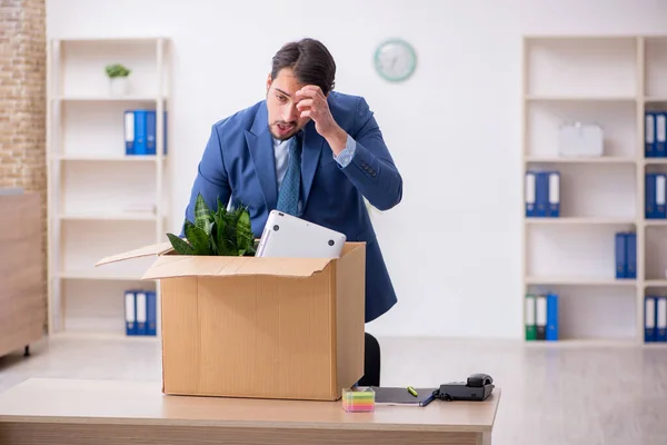 Young businessman employee in business relocation concept