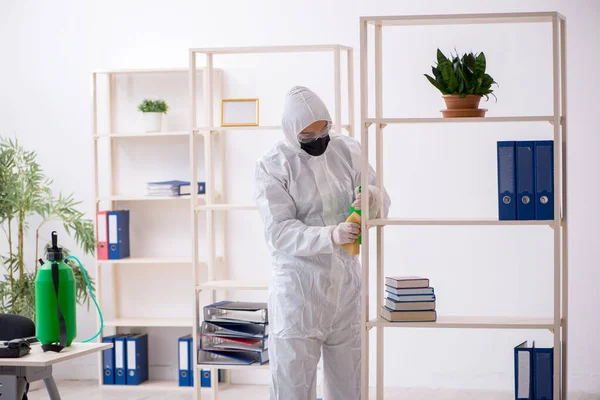 Young Contractor Disinfecting Office Pandemic — Stockfoto