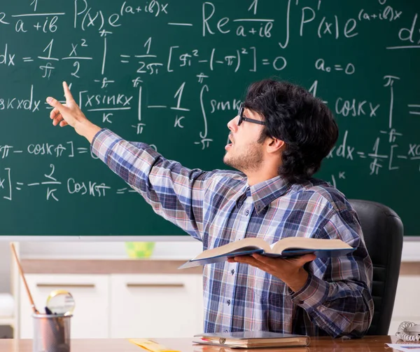 The funny male math teacher in the classroom