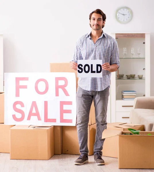 The young man offering home for sale and moving out