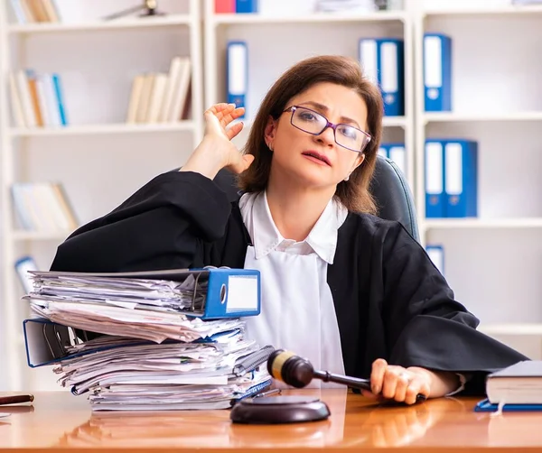 The middle-aged female doctor working in courthouse