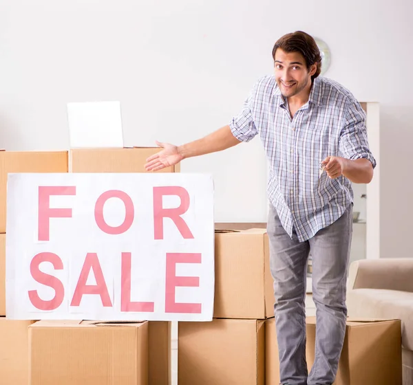 The young man offering home for sale and moving out
