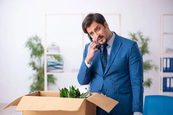 Young businessman employee in business relocation concept