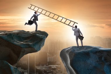 İş adamları uçurumun üstesinden gelmeye yardım ediyor.