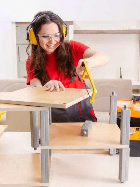 Female Contractor Repairing Furniture Home — ストック写真