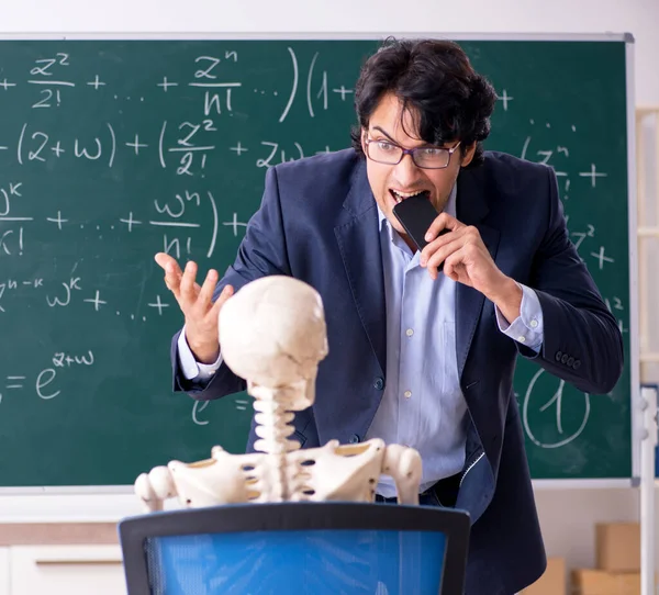 The young male math teacher and student skeleton