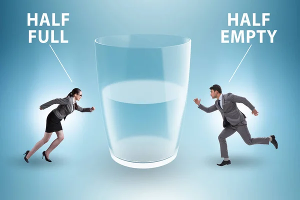 Businessman in the half empty half full glass concept