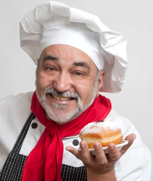 Smiling chef with Hanukkah doughnuts — Stock Photo, Image