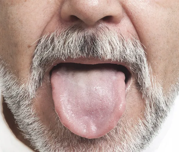 Man sticking out his tongue — Stock Photo, Image