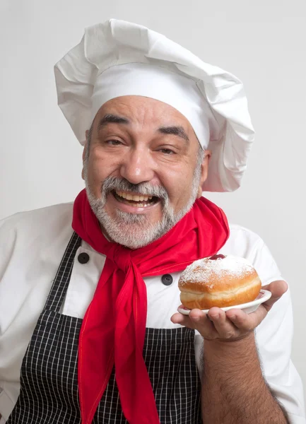 Smiling chef with Hanukkah doughnuts — Stock Photo, Image