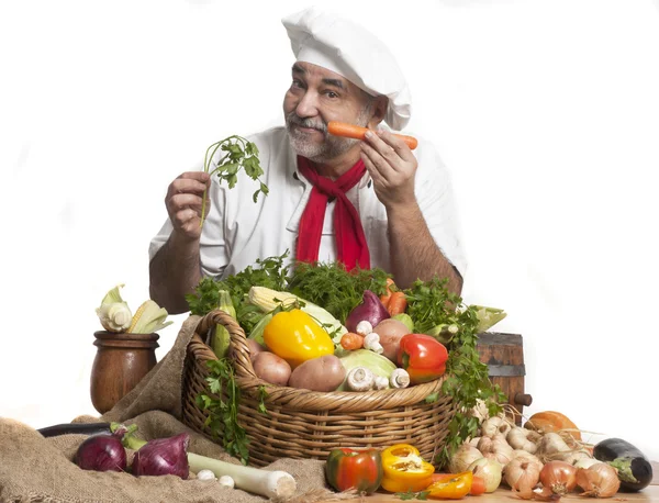Smiling attractive chef with vegetables — Stock Photo, Image