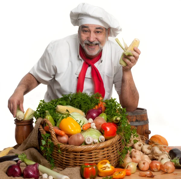 Sorrindo chef atraente com legumes — Fotografia de Stock