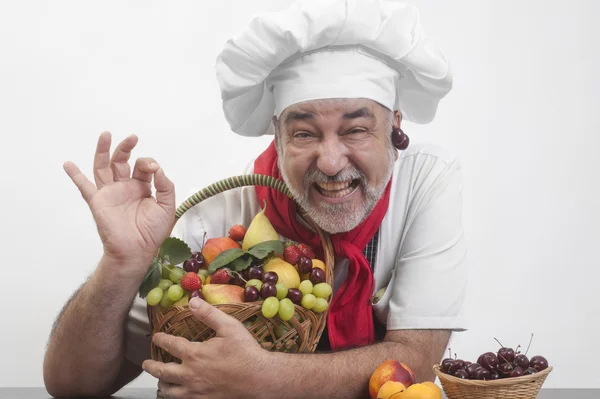 Smiling chef with fresh fruit — Stock Photo, Image