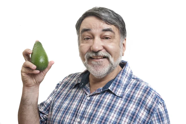 Mann isst Avocado — Stockfoto