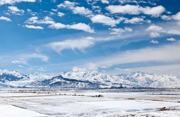 Panoramic landscape of snowy mountains in the spring — Stock Photo, Image