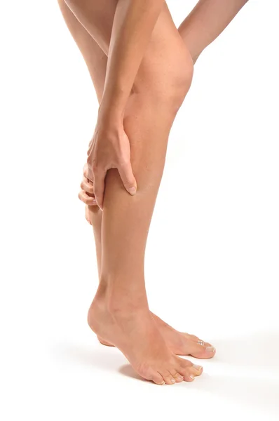 Girl massages the thin and long tired feet — Stock Photo, Image