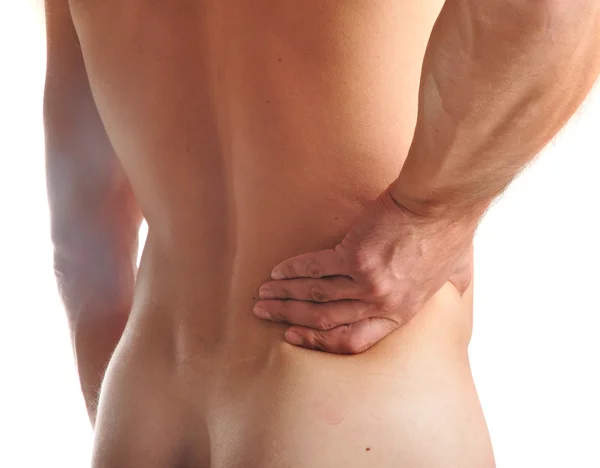 Young man with pain in a waist Stock Image
