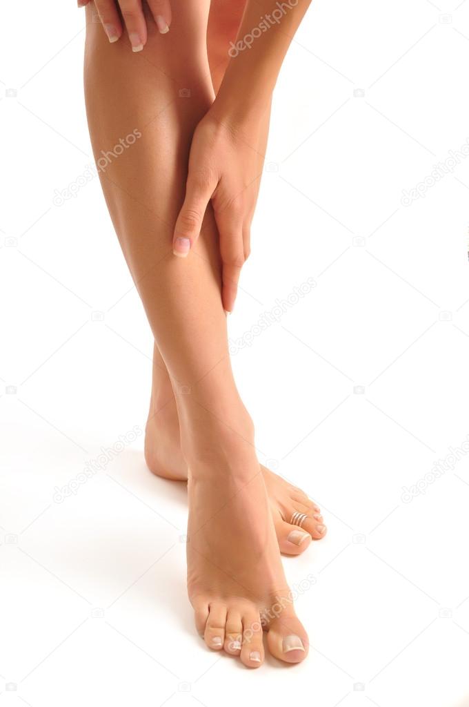 Woman holding sore leg